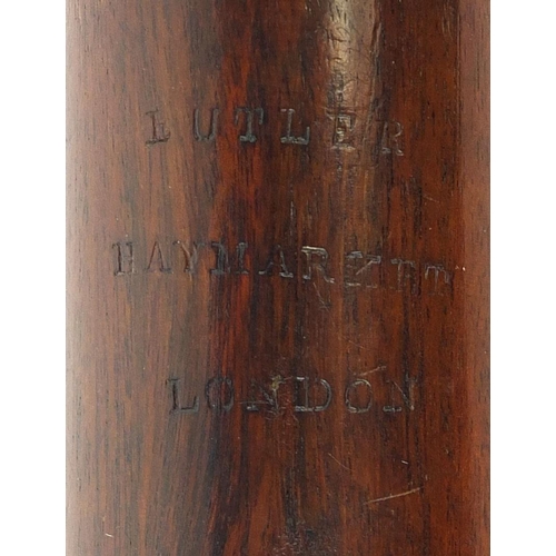 182 - Butler Hey Market of London four piece rosewood clarinet with nickel mounts, impressed marks, 69 cm ... 