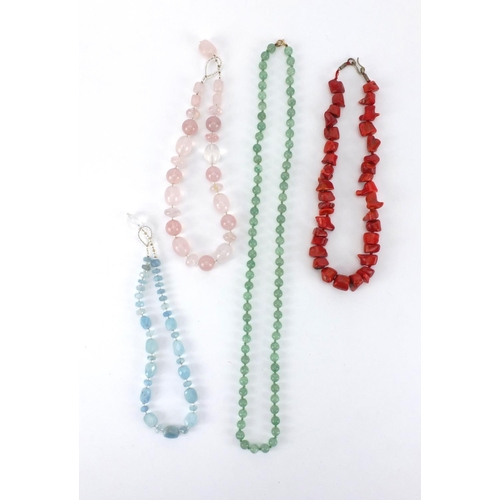 259 - Semi precious stone necklaces including quartz and a coral example