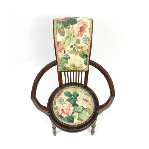 94 - Mahogany tub chair with floral upholstery, 82cm high