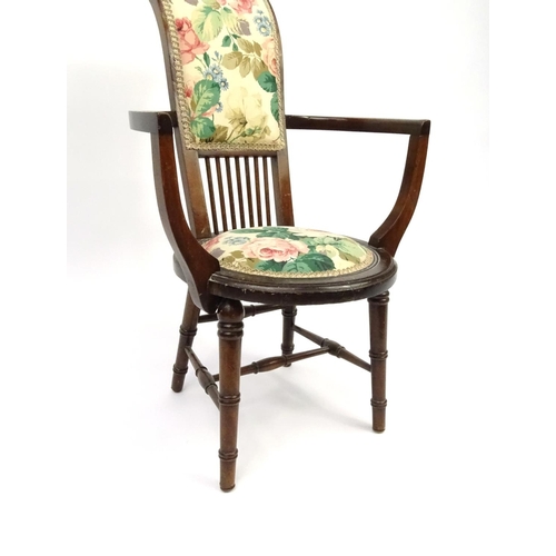 94 - Mahogany tub chair with floral upholstery, 82cm high