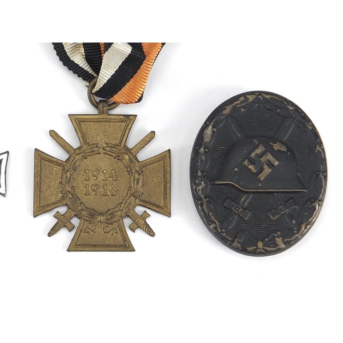 199 - German Military interest medals and badges comprising mothers cross, Merit Cross, Wounds badge and C... 