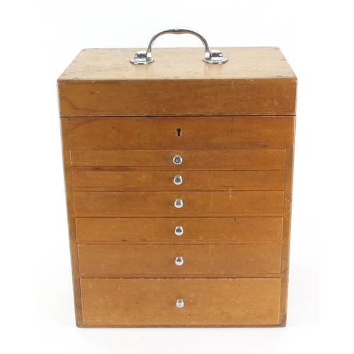 67 - Vintage dentistry table cabinet with six graduated drawers, hinged lid and a small selection of tool... 