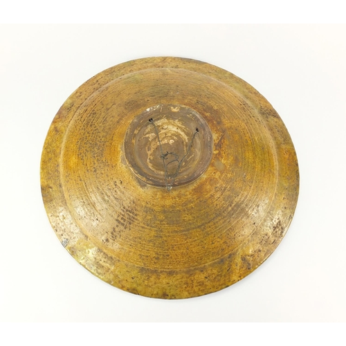 468 - Large Victorian treacle glazed pottery charger, 44cm in diameter