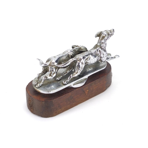 36 - Vintage chrome car mascot of two dogs, on wooden plinth, 11cm wide