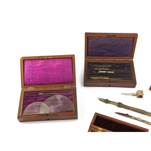 62 - Six Victorian drawing instrument sets, three being rosewood, all with fitted interiors housing instr... 