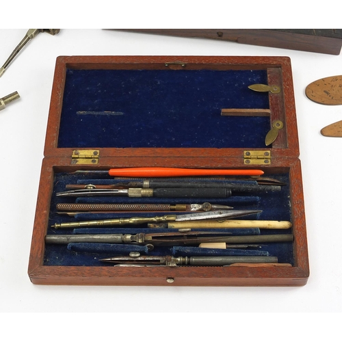 62 - Six Victorian drawing instrument sets, three being rosewood, all with fitted interiors housing instr... 