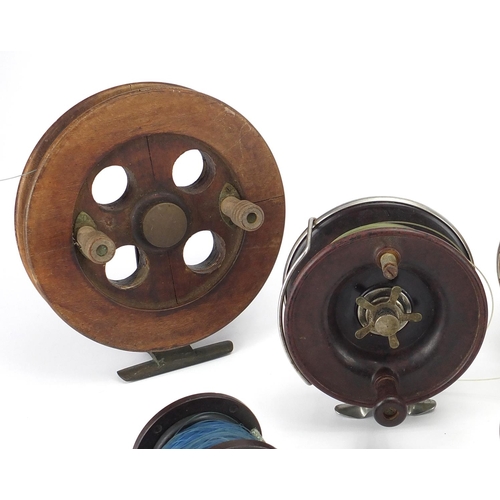 43 - Vintage fishing reels including a large Allcock & Co, Austrian Penn and Paramount examples, the larg... 