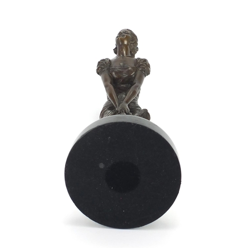 2098 - Bronze study of an Art Deco female holding her dress, raised on a circular marbleised base, signed E... 