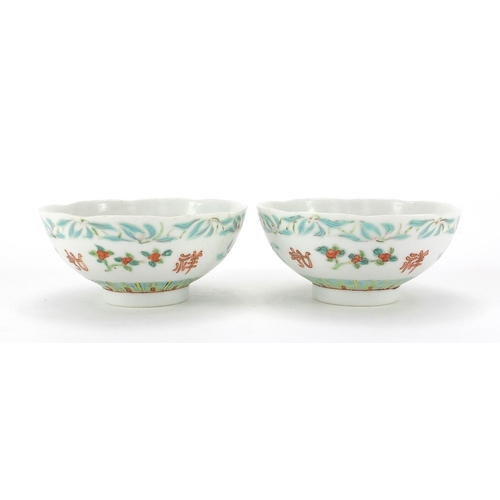 241 - Pair of Chinese porcelain footed bowls, hand panted with flowers, six figure iron red character mark... 