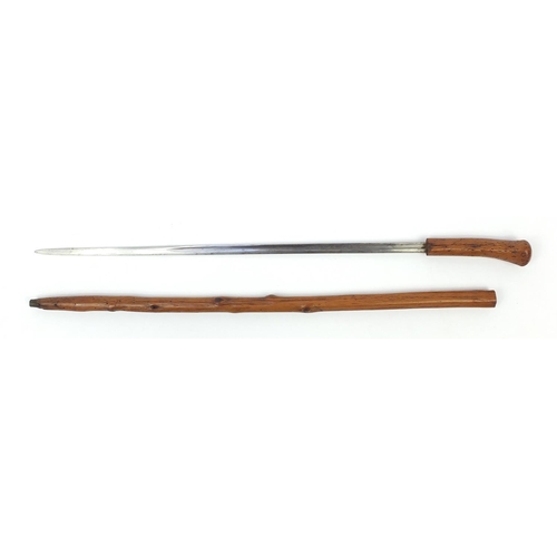 29 - Naturalistic wooden sword stick with brass ferrule and steel blade, 92cm in length
