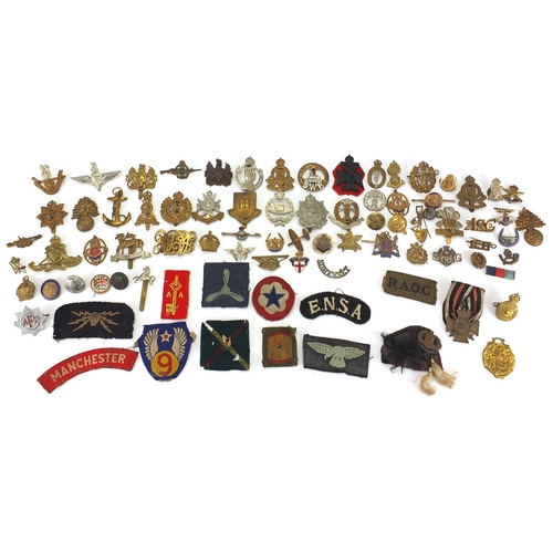 187 - Military interest cap badges, cloth insignia and a German medal including Sheffield University, Midd... 