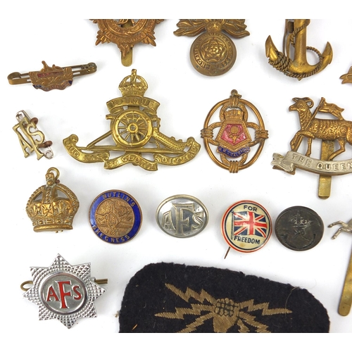 187 - Military interest cap badges, cloth insignia and a German medal including Sheffield University, Midd... 