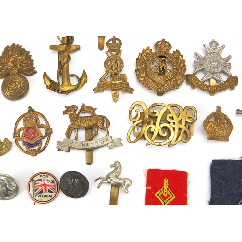 187 - Military interest cap badges, cloth insignia and a German medal including Sheffield University, Midd... 