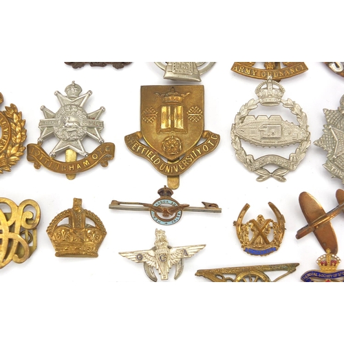 187 - Military interest cap badges, cloth insignia and a German medal including Sheffield University, Midd... 