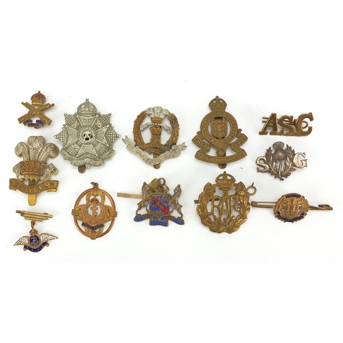 187 - Military interest cap badges, cloth insignia and a German medal including Sheffield University, Midd... 