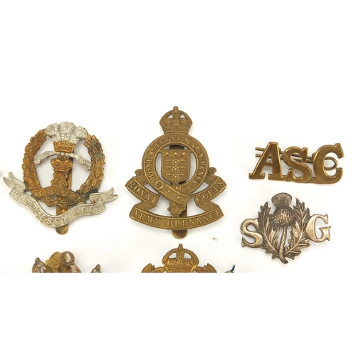 187 - Military interest cap badges, cloth insignia and a German medal including Sheffield University, Midd... 