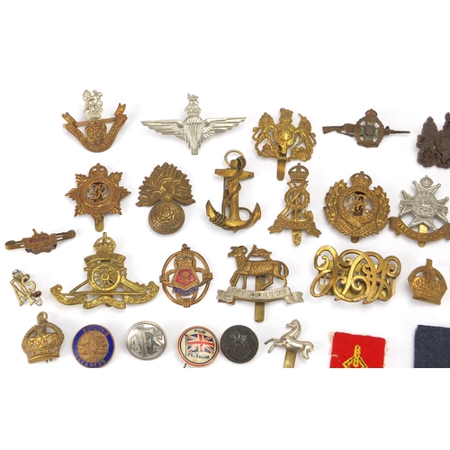 187 - Military interest cap badges, cloth insignia and a German medal including Sheffield University, Midd... 