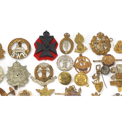 187 - Military interest cap badges, cloth insignia and a German medal including Sheffield University, Midd... 