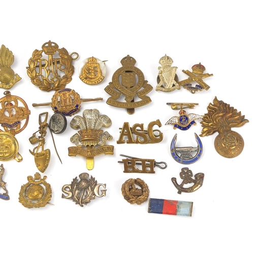 187 - Military interest cap badges, cloth insignia and a German medal including Sheffield University, Midd... 