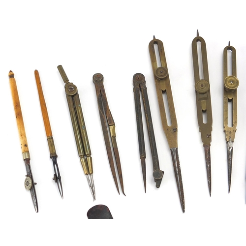 65 - Predominantly antique drawing instruments including ivory and brass folding rules, brass proportiona... 