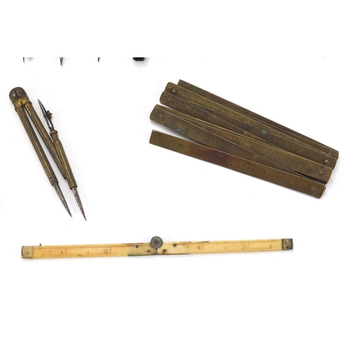 65 - Predominantly antique drawing instruments including ivory and brass folding rules, brass proportiona... 