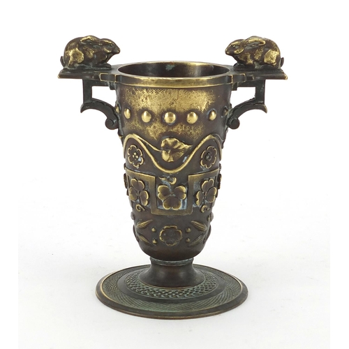 10 - 19th century bronze vase with twin handles, cast with clovers and flower heads, 11cm high