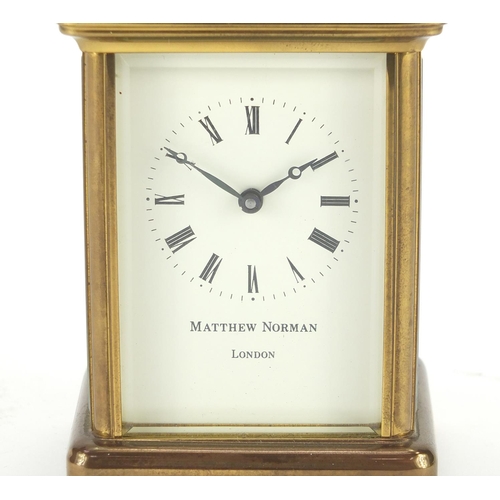 2125 - Brass cased carriage clock by Matthew Norman, 11cm high