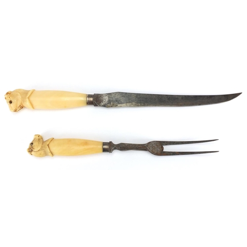 28 - Silver mounted ivory handled carving knife and fork, the animal  heads set with beaded glass eyes, t... 