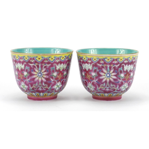 239 - Pair of Chinese porcelain tea cups, both with turquoise interiors and hand painted in the famille ro... 