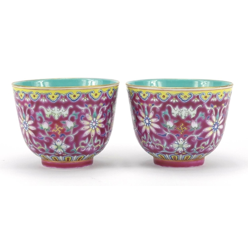 239 - Pair of Chinese porcelain tea cups, both with turquoise interiors and hand painted in the famille ro... 
