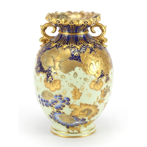 452 - Royal Crown Derby vase with twin handles, hand painted and gilded with flowers, factory marks and nu... 
