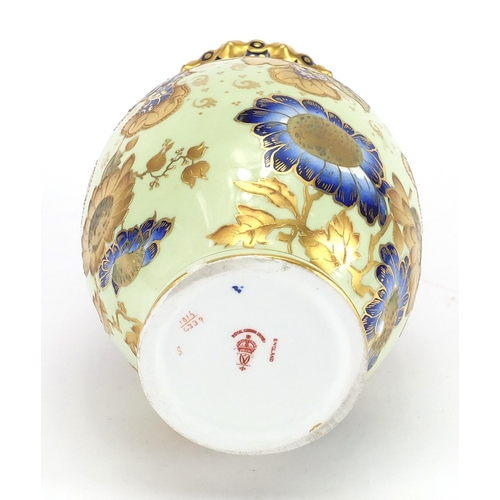 452 - Royal Crown Derby vase with twin handles, hand painted and gilded with flowers, factory marks and nu... 
