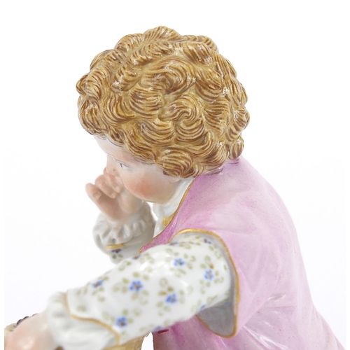 428 - 19th century hand painted Meissen porcelain figure of a young boy holding his hat bedside a pillar w... 