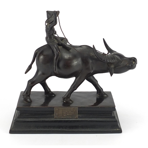 8 - Bronze study of a China man riding a water buffalo, mounted on a rectangular wooden base with silver... 