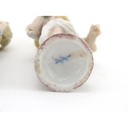 431 - Continental hand painted Berlin porcelain model of a cherub, together with a hand painted continenta... 