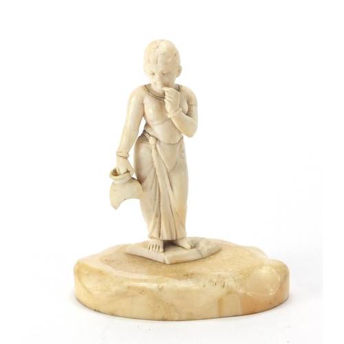 2 - Ivory carving of a young female holding a vessel on a shaped ivory base, 8.5cm high