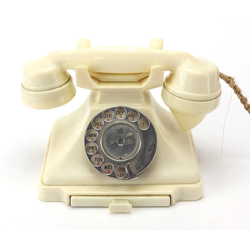 31 - Cream Bakelite pyramid dial telephone, 16cm high