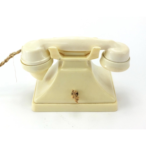 31 - Cream Bakelite pyramid dial telephone, 16cm high