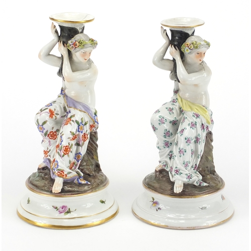 433 - Two 19th century continental porcelain candle sticks with figural semi nude maiden columns, both and... 