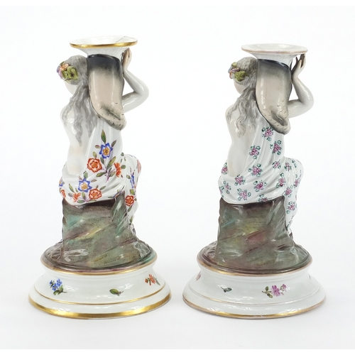 433 - Two 19th century continental porcelain candle sticks with figural semi nude maiden columns, both and... 