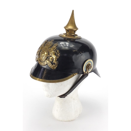 194 - German Military Pickelhaube with fitted case applied brass badge and chin strap, the pickelhaube 24c... 