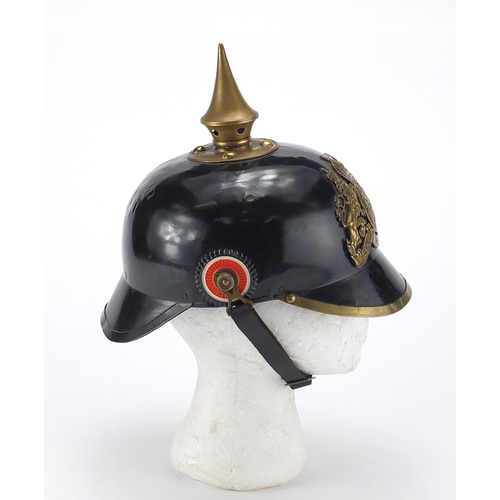 194 - German Military Pickelhaube with fitted case applied brass badge and chin strap, the pickelhaube 24c... 