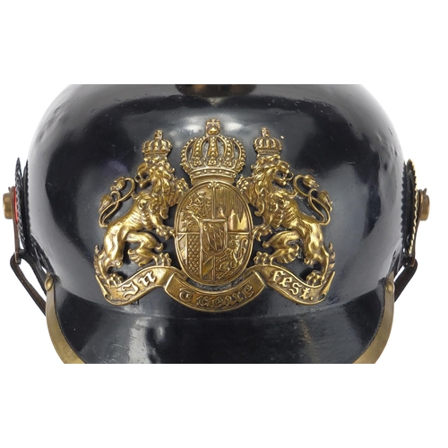 194 - German Military Pickelhaube with fitted case applied brass badge and chin strap, the pickelhaube 24c... 