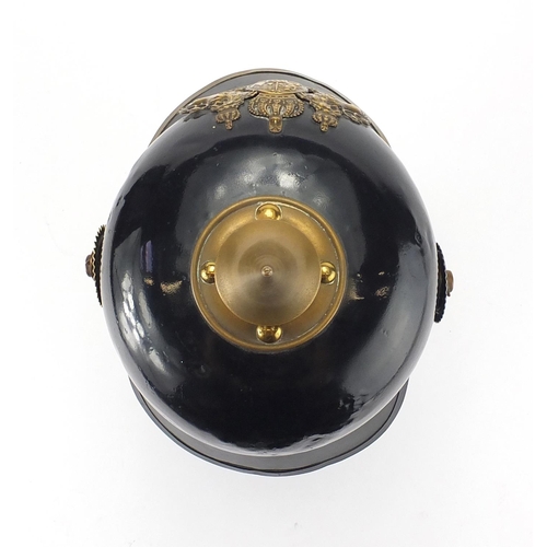 194 - German Military Pickelhaube with fitted case applied brass badge and chin strap, the pickelhaube 24c... 