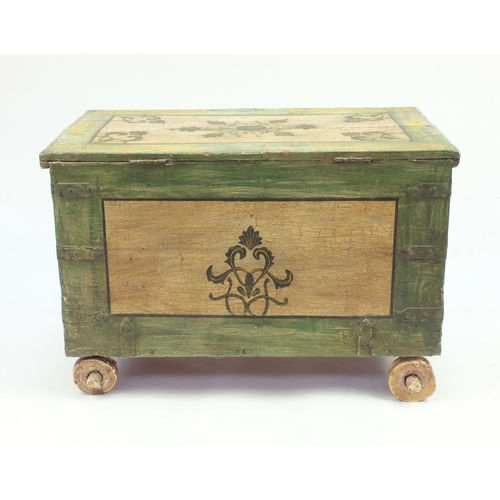 2050 - Dowry style trunk with twin carrying handles, hand painted with flowers, with wooden wheels, 53cm H ... 
