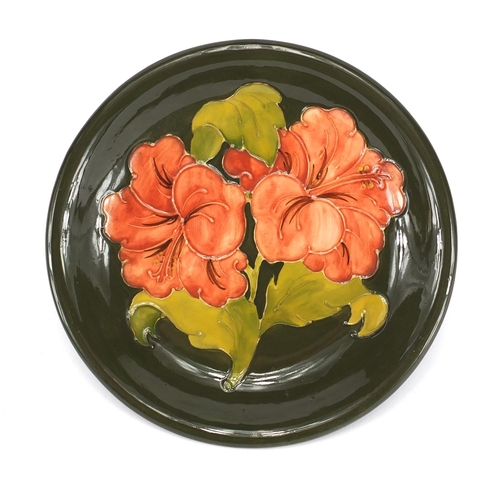 2114 - Moorcroft Hibiscus pattern plate, 21.5cm in diameter