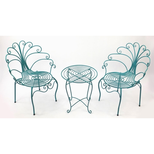 2060 - Turquoise painted metal table and chairs, the chairs 90cm high