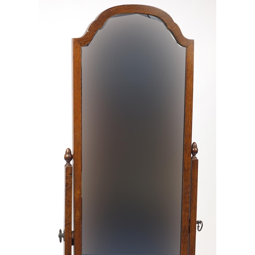 2052 - Oak framed cheval mirror with acorn finials, 158cm high