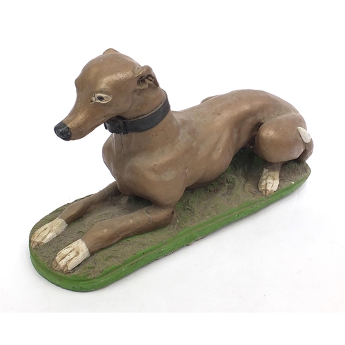 2068 - Painted stoneware garden statue greyhound, 60cm length