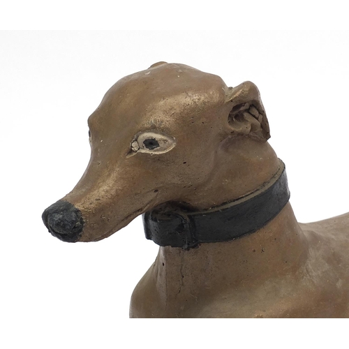 2068 - Painted stoneware garden statue greyhound, 60cm length